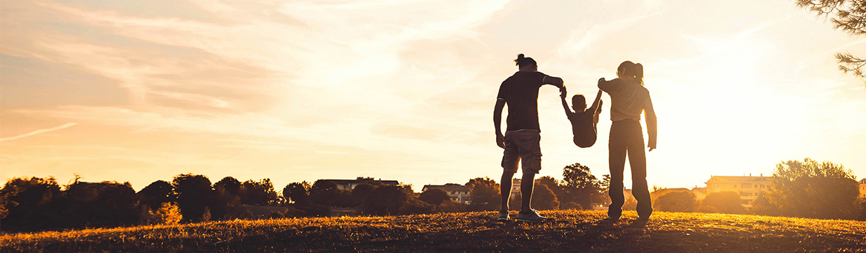 Photo of Happy Family at Sunset